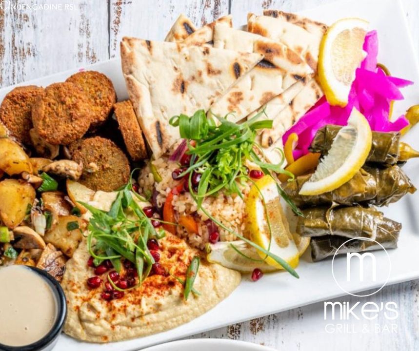 Featured image for “Our Vegan Platter is always a hit! 🤩 Homemade falafel, vine leaves stuffed with rice, pickled turnip, hommus, tahini, sauteed mushrooms & potato served with stir fried rice & pita bread”
